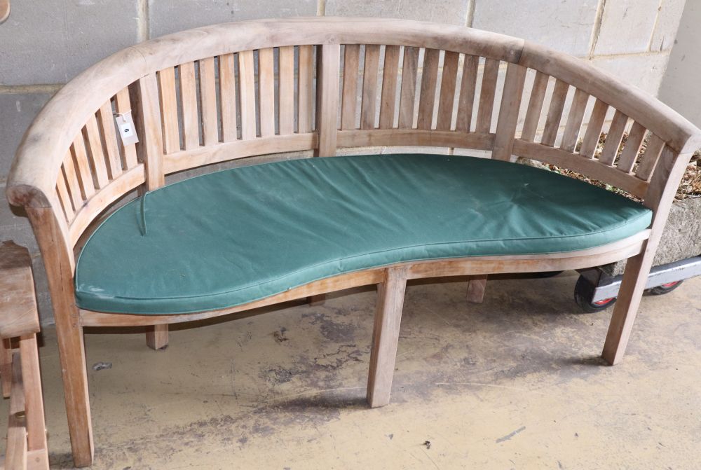 A teak banana garden bench, W.160cm, D.60cm, H.85cm